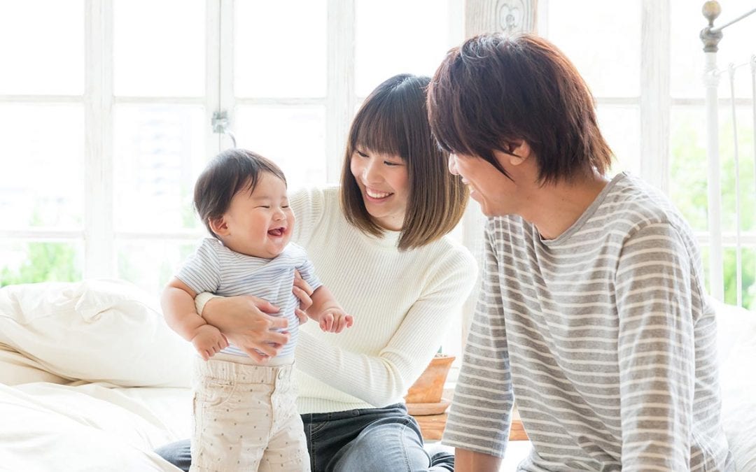 Family smiling with baby