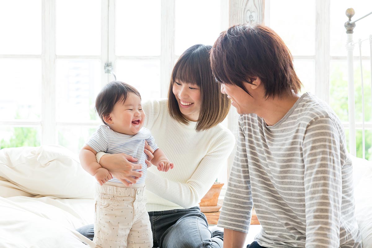 Family smiling with baby